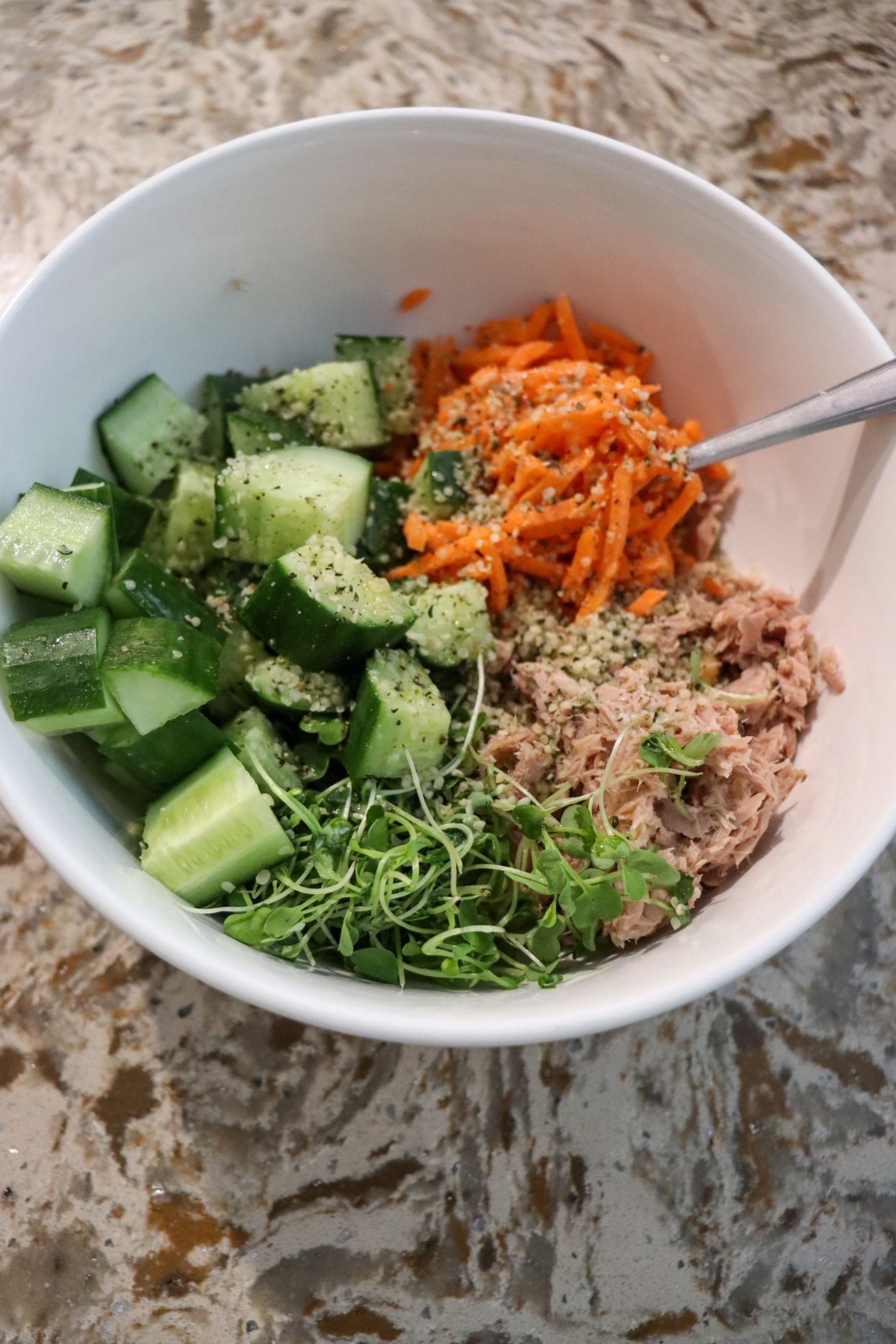 High protein tuna chickpea salad in a bowl before mixing ingredients